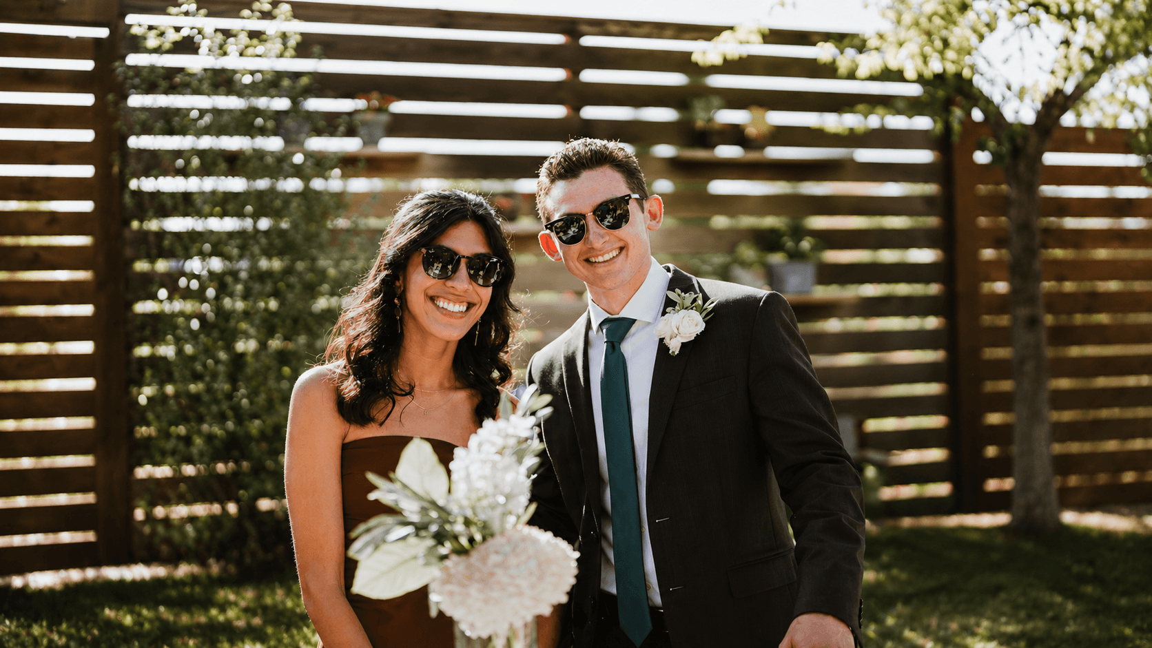 Sofia and Riley smiling together at a wedding celebration