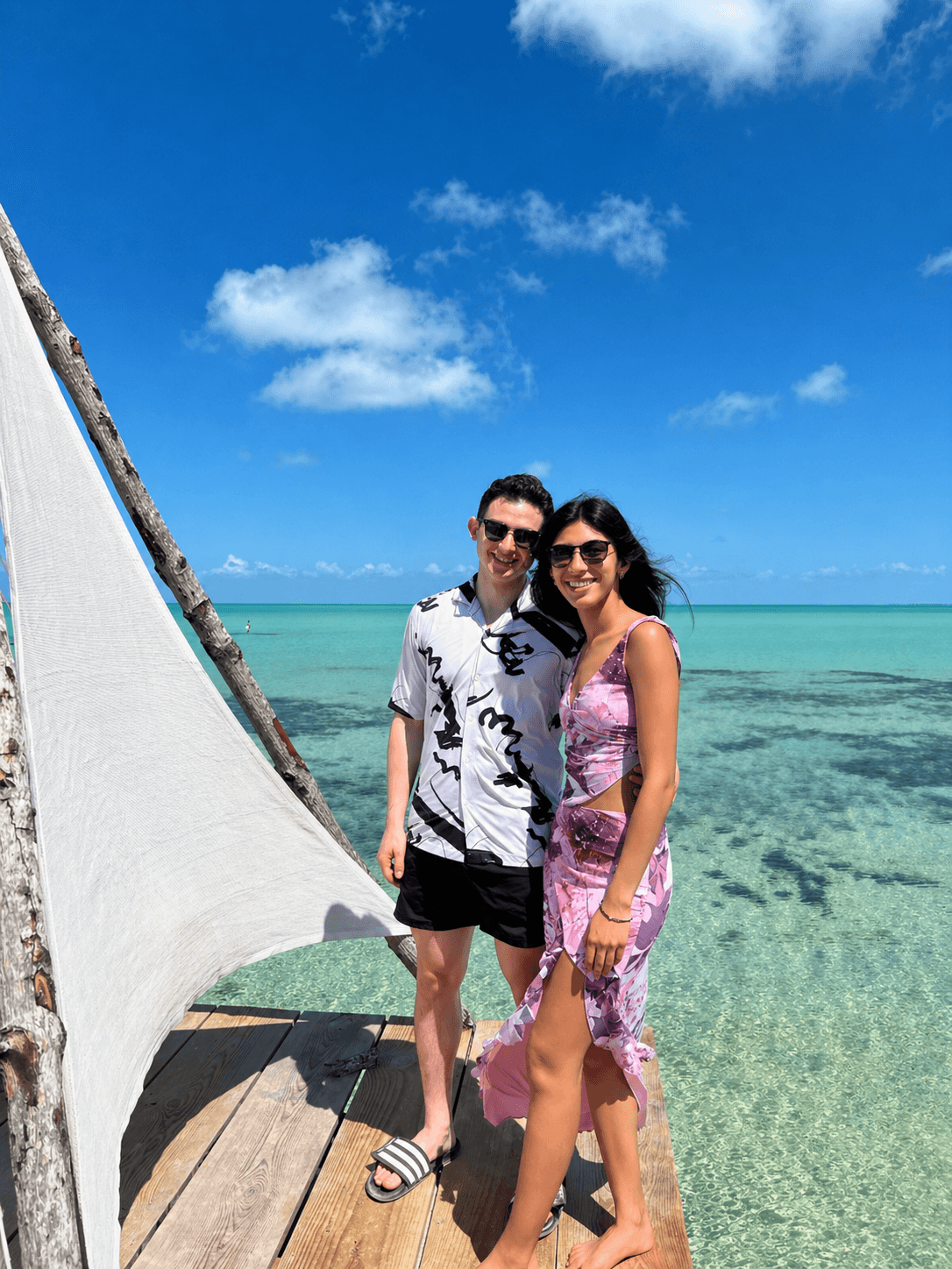 Sofia and Riley by turquoise water in Belize