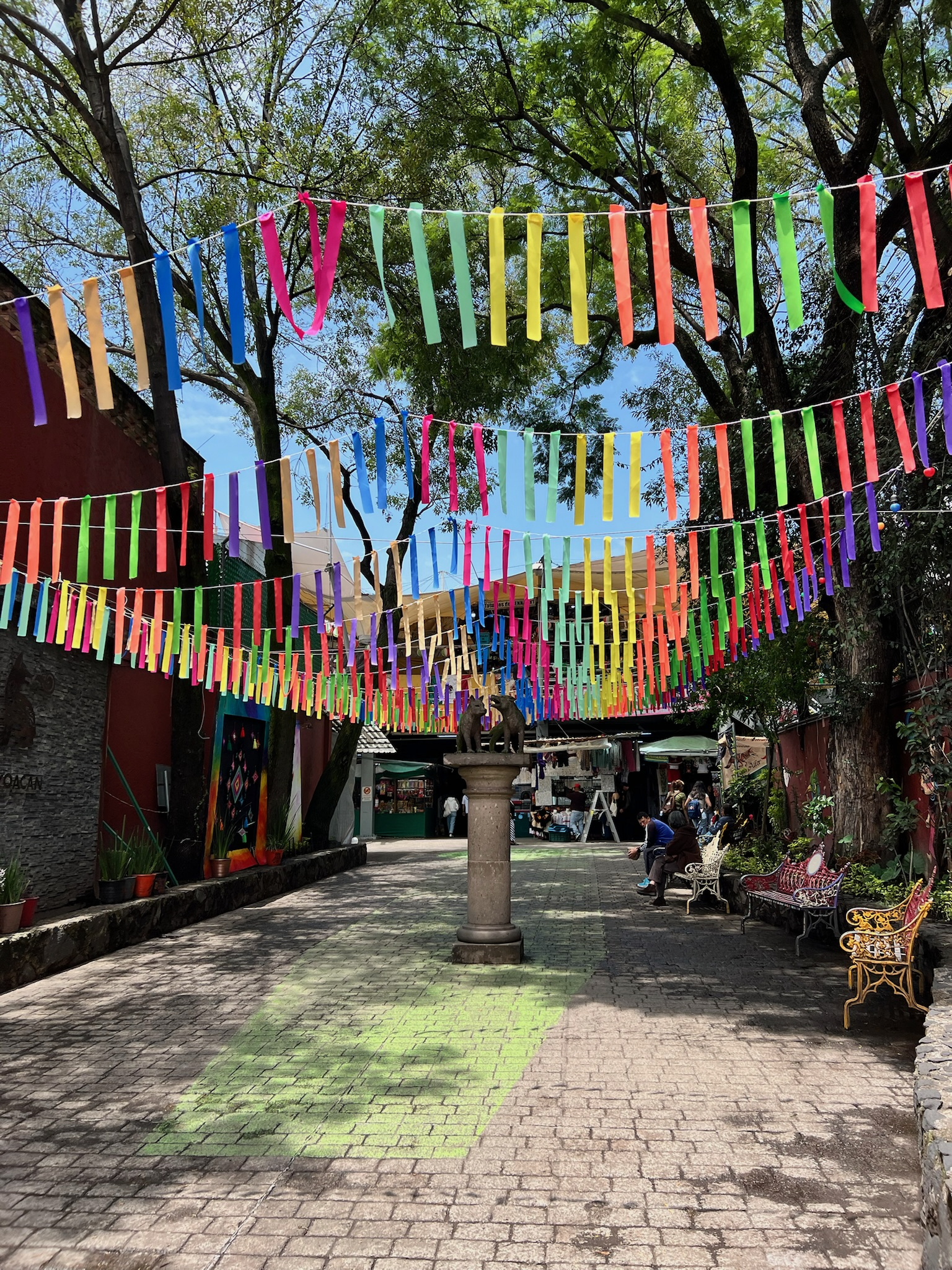 Colorful papel picado over a Tepoztlán market walkway